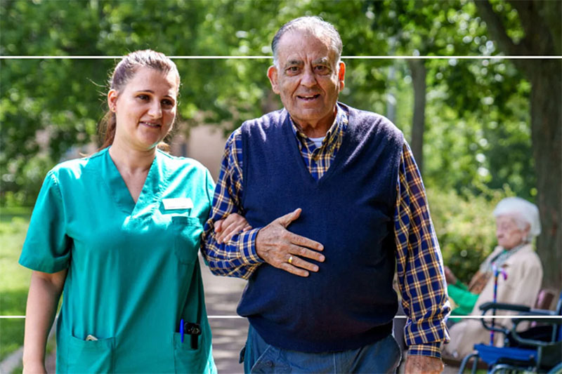 elderly man and health worker