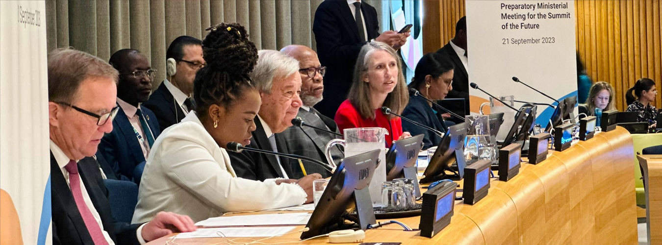 Panel of participants in a meeting with UN SG amongst them.