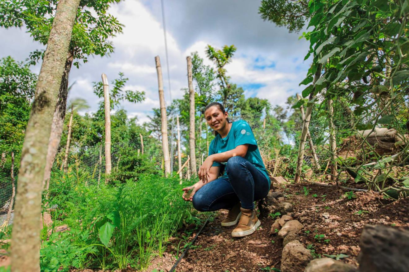 A woman conducting a study of the soil in El Salvador.
