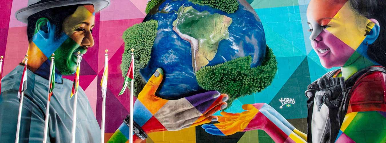 A view of the Eduardo Kobra mural which was at UN Headquarters depicting a man handing over the globe to a young girl